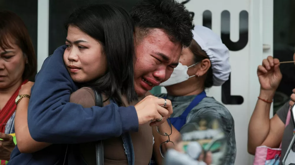 A student reacts after evacuating from Debsirin Nonthaburi School, following a shooting incident at the school, in Bang Kruai district in Nonthaburi province on the outskirts of Bangkok, Thailand, August 7, 2026. REUTERS/Chalinee Thirasupa