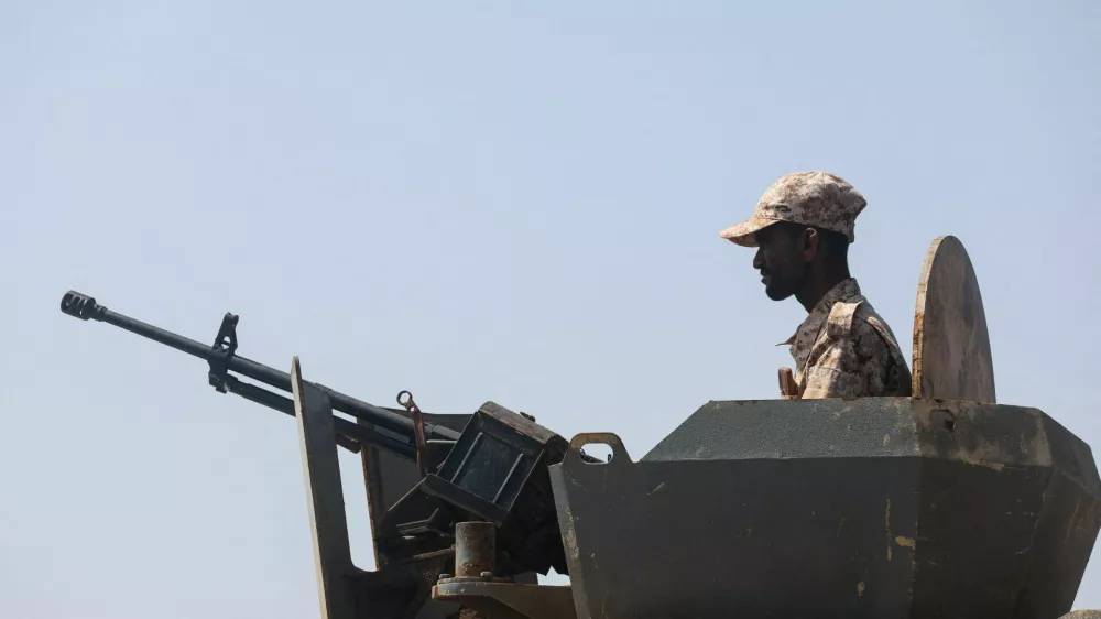 FILE PHOTO: A Yemeni soldier mans a machine gun mounted on a military patrol truck on the coast of Bab el-Mandeb, Yemen April 2, 2026. REUTERS/File Photo