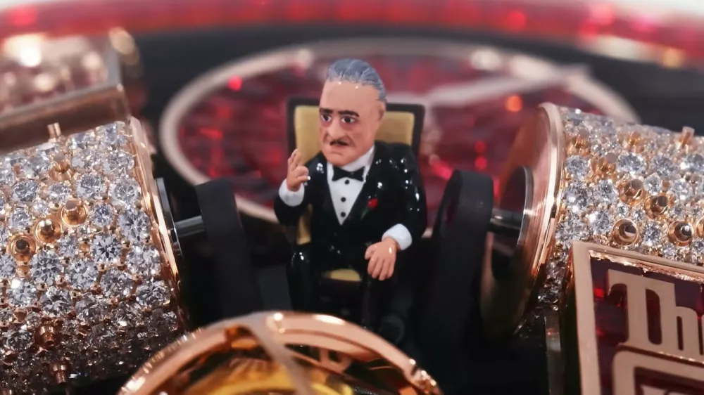 Ferrari Press AgencyGodfather 1Ref 1802906/08/2026See Ferrari textPictures MUST credit: Jacob & CoOstentatious jewellery company Jacob & Co has made a new timepiece tribute to classic movie The Godfather &mdash; including a miniature of star Marlon Brando as Mafia boss Don Vito Corleone.The $2.4 million USD timepiece is a one-off by the New York-based house.Called the Opera Godfather Baguette, it features a host of details from the 1972 Francis Ford Coppola masterpiece.A tiny, hand-sculpted figurine of Brando sitting in his iconic armchair sits right at the centre of the dial.A miniature rose gold piano sits on the dial, its keys moving while a music box plays the movie's signature GodfatherTheme, alongside a violin-shaped crank.The iconic poster puppet strings logo is integrated onto the dial plates. The watch is set with 461 red baguette sapphires across the 18 karat rose gold case, dial, crown and clasp.Each stone was individually cut to fit one position on the watch, a setting process that took craftsmen " months " to complete. Jacob & Co said the gem-setting arrangement will never be replicated again. It took the brand over a year just to source and match the colour, quality, and consistency of the stones. The watch contains 658 components built entirely by hand, combining high-end watchmaking with micro-mechanical engineering.OPS: The Opera Godfather Baguette watch.Picture supplied by Ferrari,Image: 1121010620, License: Rights-managed, Restrictions:, Model Release: no 