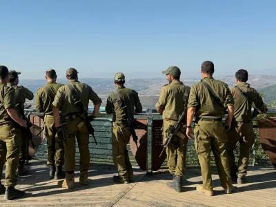 Israeli soldiers look towards Lebanon, from the Israeli side of the Israel-Lebanon border in northern Israel, August 5, 2026. REUTERS/Avi Ohayon