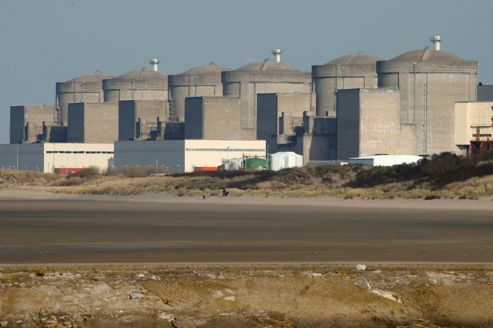 FILE PHOTO: The Gravelines nuclear power plant is seen across the beach in Petit Fort Philippe, northern France, March 10, 2017. REUTERS/Pascal Rossignol/File Photo