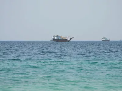 Vessels near the Strait of Hormuz, as seen from Musandam, Oman, August 6, 2026. REUTERS/Stringer