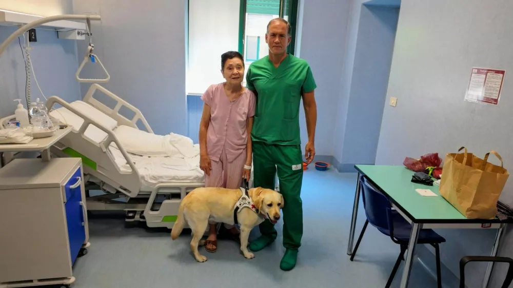 Italy, Turin - July 26, 2026.Central retinal autotransplantation performed for the first time in the world at Molinette Hospital. Elena, 67, has regained the sight she lost in an accident. Dr. Michele Reibaldi of Molinette Hospital in Turin poses with her patient Elena, who was blinded in a car accident. Dr. Michele Reibaldi is director of the University Eye Clinic at Molinette Hospital (Citt&Atilde;&nbsp; della Salute e della Scienza) in Turin,Image: 1118945081, License: Rights-managed, Restrictions: * France, Germany and Italy Rights Out *, Model Release: no / Foto: Unk Via Profimedia