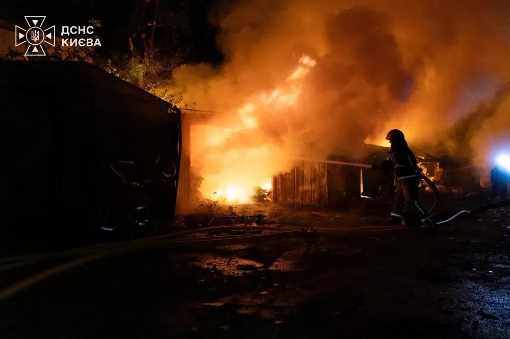 Firefighters work at a compound of car garages damaged during overnight Russian missile strikes, amid Russia's attack on Ukraine, in Kyiv, Ukraine August 8, 2026. Press service of the State Emergency Service of Ukraine/Handout via REUTERS ATTENTION EDITORS - THIS IMAGE HAS BEEN SUPPLIED BY A THIRD PARTY. DO NOT OBSCURE LOGO.