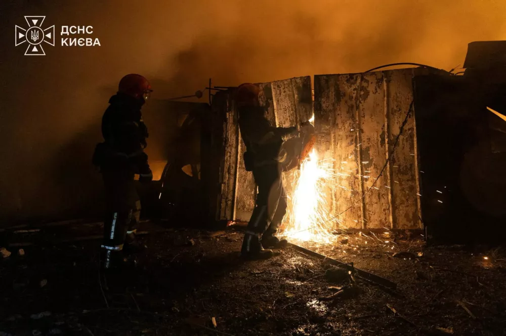 Firefighters work at a compound of car garages damaged during overnight Russian missile strikes, amid Russia's attack on Ukraine, in Kyiv, Ukraine August 8, 2026. Press service of the State Emergency Service of Ukraine/Handout via REUTERS ATTENTION EDITORS - THIS IMAGE HAS BEEN SUPPLIED BY A THIRD PARTY. DO NOT OBSCURE LOGO.