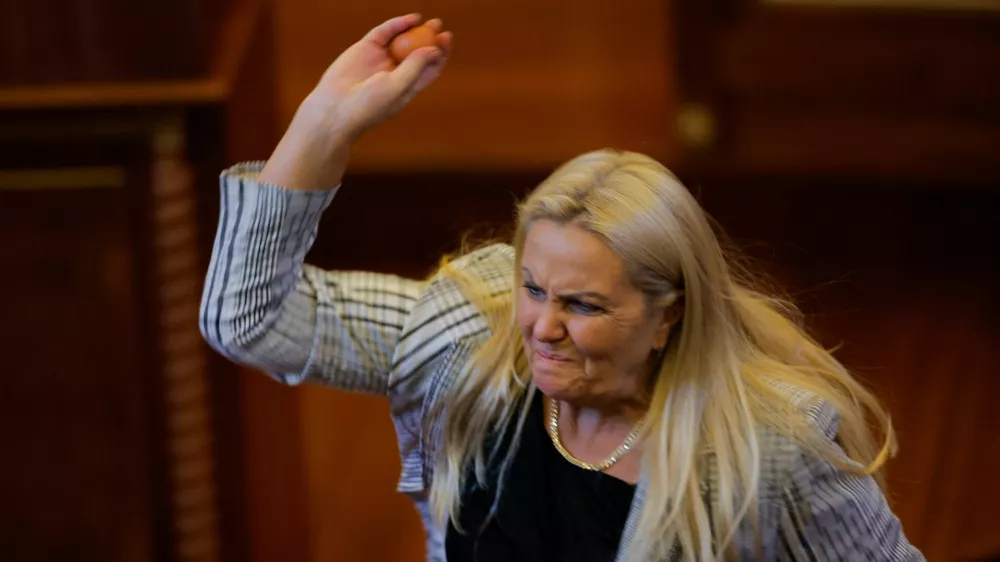 Kosovo lawmaker Time Kadriaj throws an egg at Prime Minister Albin Kurti (not pictured) during the plenary session to elect the new speaker of the parliament in Pristina, Kosovo August 8, 2026. Kosovo parliament remains unconstituted. REUTERS/Valdrin Xhemaj