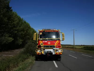 A fire engine of the Ukrainian Fire Service operates near a wildfire-hit area in Le Temple, Gironde, amongst worsening drought conditions following a heatwave and water shortages across much of France, August 7, 2026. REUTERS/Nicolas Economou