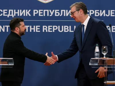 Serbian President Aleksandar Vucic and Ukrainian President Volodymyr Zelenskiy shake hands at the end of a press conference during Zelenskiy's visit to Belgrade, Serbia, August 8, 2026. REUTERS/Marko Djurica