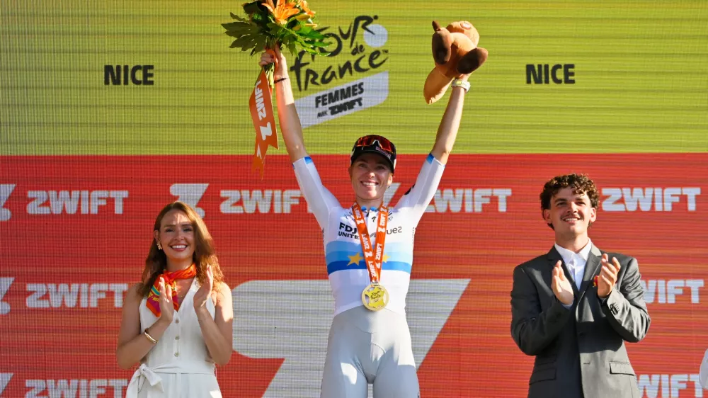 Netherlands' Demi Vollering celebrates on the podium after winning the eighth stage of the Women's Tour de France cycling race (Tour de France Femmes) between Sisteron and Nice in Nice, France, Saturday, Aug. 8, 2026. (AP Photo/Philippe Magoni)