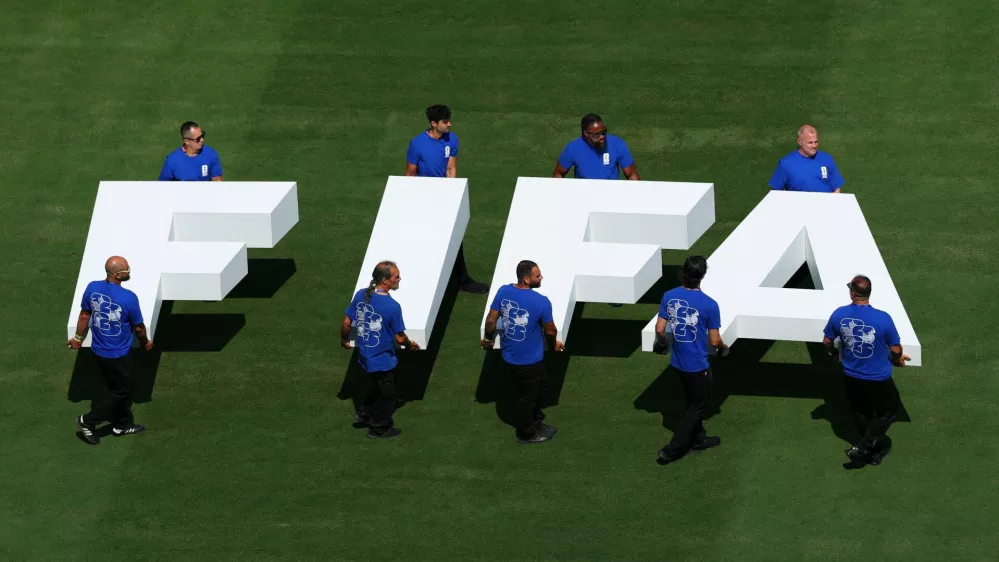 FILE PHOTO: Soccer Football - FIFA World Cup 2026 - Final - Spain v Argentina - New York/New Jersey Stadium, East Rutherford, New Jersey, U.S. - July 19, 2026 Pitch staff carry the FIFA logo on the pitch before the match REUTERS/Mike Segar/File Photo