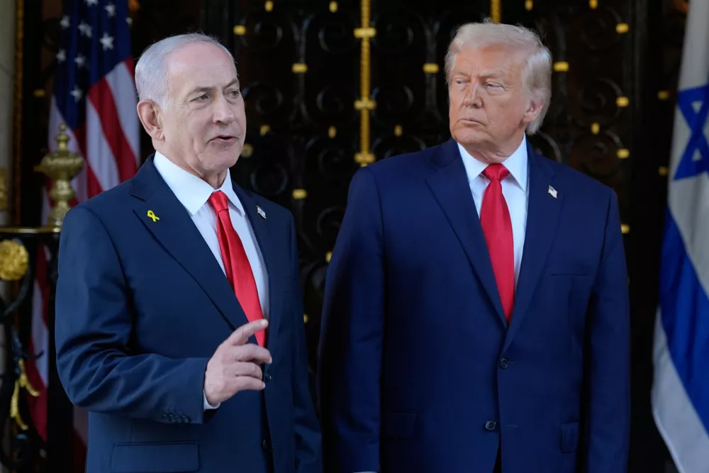 FILE - President Donald Trump listens as Israel's Prime Minister Benjamin Netanyahu speaks at President Donald Trump's Mar-a-Lago club, Dec. 29, 2025, in Palm Beach, Fla. (AP Photo/Alex Brandon, File)