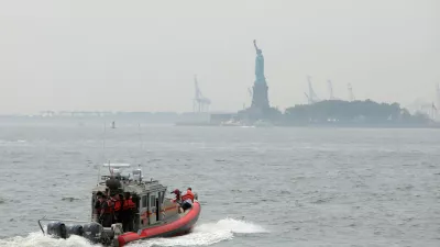 Emergency crews head toward the Statue of Liberty after a fire broke out on Liberty Island forcing an evacuation in Manhattan, New York, U.S., August 27, 2018. REUTERS/Andrew Kelly