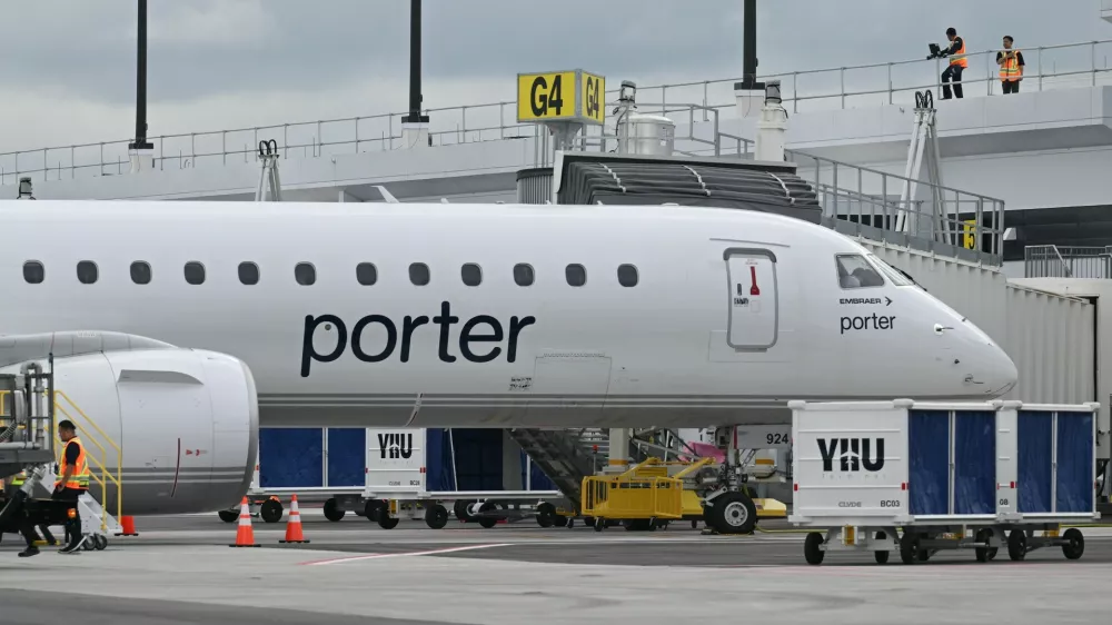 A Porter Airlines jet sits at a gate at Montreal Metropolitan Airport, in Longueuil, Quebec, on Monday, June 15, 2026. (Graham Hughes/The Canadian Press via AP)