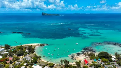 Aerial view of Cap Malheureux, Mauritius showing homes near vibrant reefs