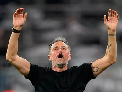 PSG's head coach Luis Enrique celebrates after the Champions League semifinal second leg soccer match between Bayern Munich and Paris Saint Germain in Munich, Germany, Wednesday, May 6, 2026. (AP Photo/Martin Meissner)
