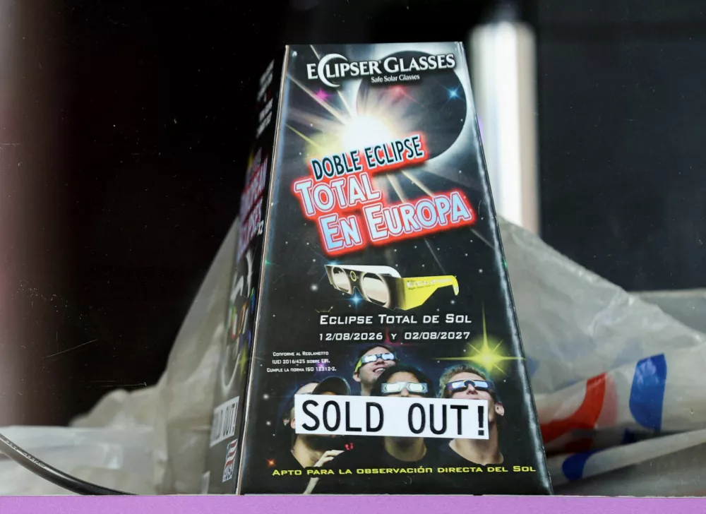 An empty box of sold out solar eclipse glasses is displayed in a shop window, in London, Britain, August 11, 2026. REUTERS/Corey Rudy