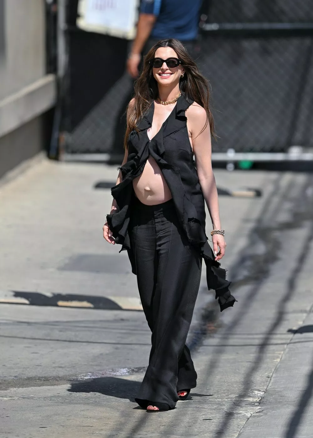 08/10/2026 Anne Hathaway shows off her growing baby bump at Jimmy Kimmel Live in Los Angeles. The 43 year old American actress who is expecting her third child wore a black blouse, matching trousers and heels.,Image: 1122311230, License: Rights-managed, Restrictions: NO usage without agreed price and terms. Please contact The Image Direct at sales@theimagedirect.com, Model Release: no, Pictured: Anne Hathaway 