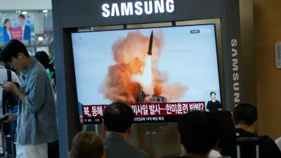 A TV screen shows a file image of North Korea's missile launch during a news program at Seoul Railway Station in Seoul, South Korea, Wednesday, Aug. 12, 2026. (AP Photo/Ahn Young-joon)