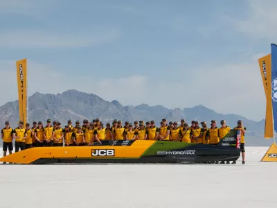British driver Andy Green and the JCB engineering team pose with the car used to set a new land speed record for a hydrogen-powered vehicle, Tuesday, Aug. 11, 2026, at the Bonneville Salt Flats in Utah. (AP Photo/Hannah Schoenbaum)