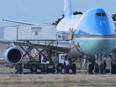 Catering trucks are parked at Air Force One on the tarmac as the motorcade carrying U.S. President Donald Trump arrives to depart following the NATO summit at Ankara International Airport in Ankara, Turkey, Wednesday, July 8, 2026. (AP Photo/Alex Brandon)