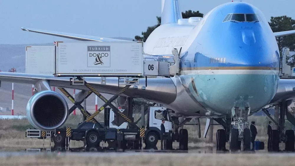 Catering trucks are parked at Air Force One on the tarmac as the motorcade carrying U.S. President Donald Trump arrives to depart following the NATO summit at Ankara International Airport in Ankara, Turkey, Wednesday, July 8, 2026. (AP Photo/Alex Brandon)