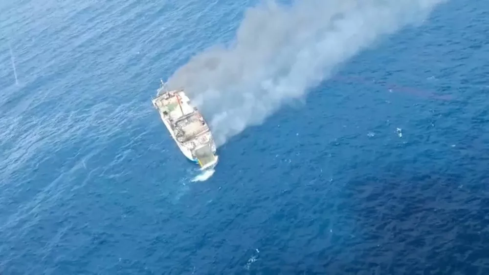 An aerial view shows thick smoke rising from KM Putri Yasmin ferry that caught fire in waters off Lombok, Indonesia, August 12, 2026, in this screengrab taken from a handout video. Basarnas/Handout via REUTERS  THIS IMAGE HAS BEEN SUPPLIED BY A THIRD PARTY.