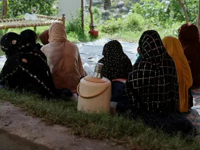 Women sit inside a tent while taking refuge with others following the deadly earthquake in Bambakot village, Dera Noor district, Nangarhar province, Afghanistan, September 6, 2025. REUTERS/Sayed Hassib