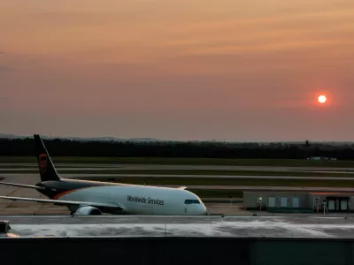 The sun sets behind a UPS plane at Washington Dulles International Airport, which U.S. President Donald Trump has proposed a  billion renovation plan, in Dulles, Virginia, U.S., August 9, 2026. REUTERS/Kylie Cooper