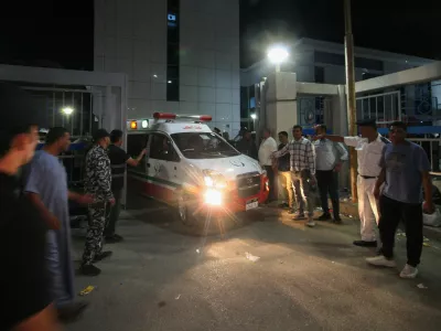 Families of Egyptian workers killed in a road accident surround an ambulance, as ambulances carry bodies of their loved ones, outside Al Qasasin Specialized Hospital in Ismailia, Egypt, August 11, 2026. Several people were killed, and others were injured when two pickup trucks carrying workers collided in Egypt's Ismailia Governorate, the Health Ministry said. REUTERS/Shokry Hussein
