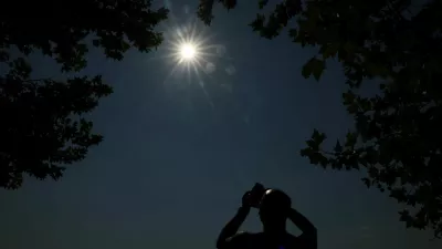 Valerio D'Orazio, from Lisbon, Portugal, uses an app on his mobile phone to find out where the totality will appear during the total solar eclipse, at an eclipse watching party in Buitrago del Lozoya, Spain, August 12, 2026. REUTERS/Susana Vera