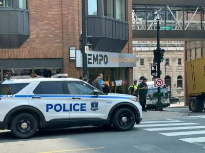 Police direct people asked to evacuate at the intersection of Barrington Street and Duke Street, in downtown Halifax, on Monday, Aug. 10, 2026. (Devin Stevens /The Canadian Press via AP)