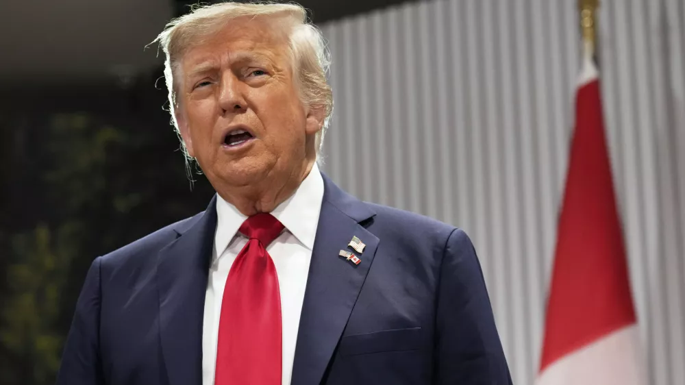President Donald Trump speaks during a meeting with Canada's Prime Minister Mark Carney on the sidelines of the G7 Summit, Monday, June 16, 2025, in Kananaskis, Canada. (AP Photo/Mark Schiefelbein)