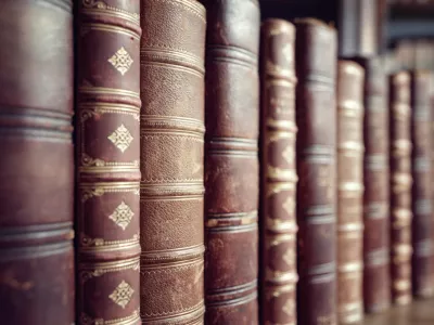 Old leather bound vintage books in a row