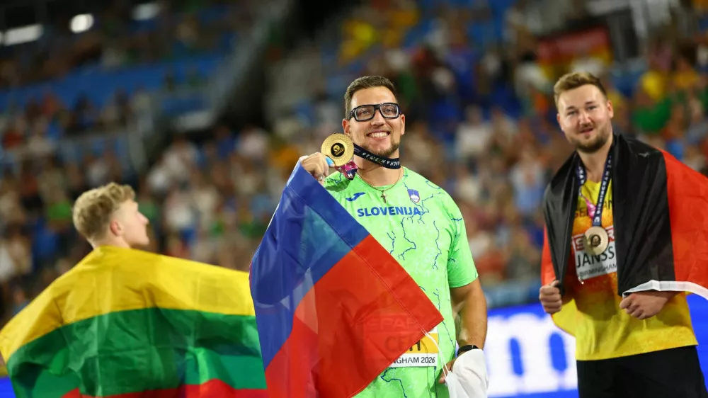 Athletics - European Athletics Championships - Alexander Stadium, Birmingham, Britain - August 13, 2026 Gold medallist Slovenia's Kristjan Ceh celebrates winning the Men's Discus Throw Final with silver medallist Lithuania's Mykolas Alekna and bronze medallist Germany's Henrik Janssen REUTERS/Hannah Mckay