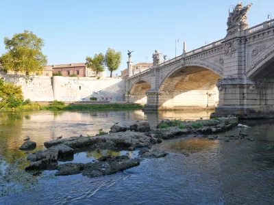 The ruins of the ancient Roman Neronian bridge, emerge from the riverbed of the Tiber river due to drought, in Rome, Thursday, Aug. 13, 2026. (AP Photo/Gregorio Borgia)