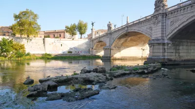 The ruins of the ancient Roman Neronian bridge, emerge from the riverbed of the Tiber river due to drought, in Rome, Thursday, Aug. 13, 2026. (AP Photo/Gregorio Borgia)
