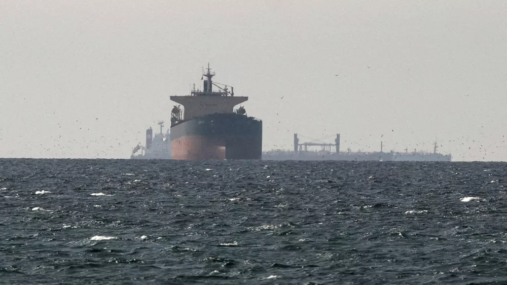 FILE PHOTO: FILE PHOTO: Cargo ships in the Gulf, near the Strait of Hormuz, as seen from northern Ras al-Khaimah, near the border with Oman's Musandam governance, amid the U.S.-Israeli conflict with Iran, in United Arab Emirates, March 11, 2026. REUTERS/Stringer/File Photo