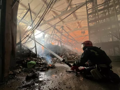 FILE PHOTO: A firefighter works at the site of a book warehouse hit by a Russian drone strike, amid Russia's attack on Ukraine, in Kharkiv, Ukraine, August 1, 2026. Picture taken with a mobile phone. REUTERS/Volodymyr Pavlov/File Photo