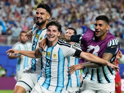 Argentina's Julian Alvarez (9) celebrates after scoring his side's second goal during the World Cup quarterfinal soccer match against Switzerland in Kansas City, Mo., Saturday, July 11, 2026. (AP Photo/Charlie Riedel)