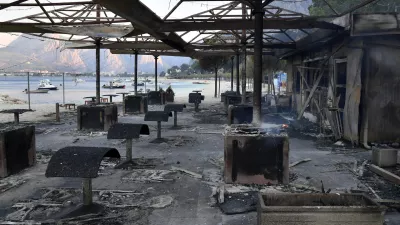 A view of a beach bar in the aftermath of a wildfire on the Adriatic coast near Omis, southern Croatia, Friday, Aug. 14, 2026. (AP Photo/Josko Ponos)
