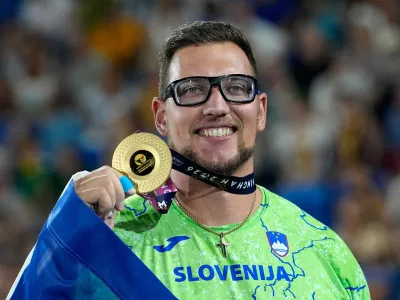 Kristjan Ceh of Slovenia poses after winning the gold medal in the men's discus throw final at the European Athletics Championships in Birmingham, England, Thursday, Aug. 13, 2026. (AP Photo/Matthias Schrader)