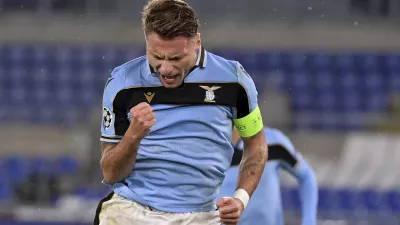Lazio's Ciro Immobile celebrates after scoring his side's 2nd goal, during the Champions League, group F soccer match between Lazio and Club Brugge, at the Rome Olympic Stadium, Tuesday, Dec. 8, 2020. (Alfredo Falcone/LaPresse via AP)