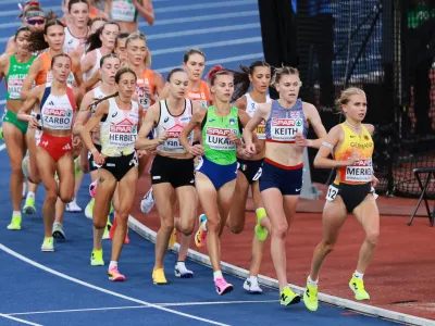 Lisa Merkel of Germany, Megan Keith of Britain, Klara Lukan of Slovenia and Nadia Battocletti of Italy lead the women's 10,000 meters final at the European Athletics Championships in Birmingham, England, Friday, Aug. 14, 2026. (AP Photo/Morgan Harlow)