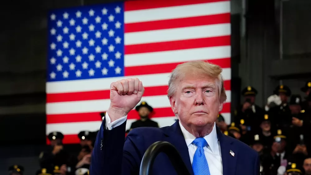 President Donald Trump gestures after speaking at the David Mack Center for Training and Intelligence, Friday, Aug. 14, 2026, in Garden City, N.Y. (AP Photo/Julia Demaree Nikhinson)