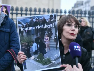 A woman holds a placard with a drawing of the student Ahou Daryaei. In support of the Iranian student Ahou Daryaei, a group of feminist associations organised a rally in the Place du Pantheon to demand her immediate release. Paris, France, on November 05, 2024. Photo by Karim Ait Adjedjou/ABACAPRESS.COM