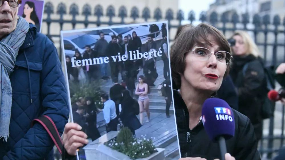 A woman holds a placard with a drawing of the student Ahou Daryaei. In support of the Iranian student Ahou Daryaei, a group of feminist associations organised a rally in the Place du Pantheon to demand her immediate release. Paris, France, on November 05, 2024. Photo by Karim Ait Adjedjou/ABACAPRESS.COM
