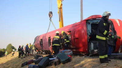 Firefighters work at the scene of a deadly accident, where a Polish bus carrying tourists veered off the motorway and overturned, near Mezokeresztes, Hungary, in this handout image released on August 16, 2026. Balazs Toth/Mezokovesd Kepekben/Handout via REUTERS THIS IMAGE HAS BEEN SUPPLIED BY A THIRD PARTY. FOR EDITORIAL USE ONLY. NO RESALES. NO ARCHIVES. MANDATORY CREDIT