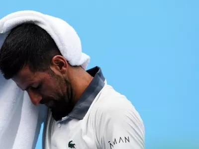 Aug 15, 2026; Mason, OH, USA; Novak Djokovic (SRB) wipes his head after a point against Thiago Agust&iacute;n Tirante (ARG) during the Cincinnati Open at Lindner Family Tennis Center. Mandatory Credit: Aaron Doster-Imagn Images