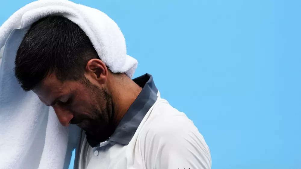 Aug 15, 2026; Mason, OH, USA; Novak Djokovic (SRB) wipes his head after a point against Thiago Agust&iacute;n Tirante (ARG) during the Cincinnati Open at Lindner Family Tennis Center. Mandatory Credit: Aaron Doster-Imagn Images