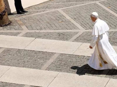 Pope Leo walks following the Angelus prayer in Piazza della Liberta in Castel Gandolfo, near Rome, Italy, August 16, 2026. REUTERS/Remo Casilli
